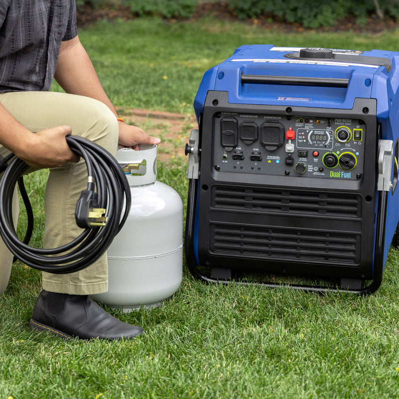Westinghouse | iGen11000DFc dual fuel portable inverter generator with co sensor sitting in a yard with someone about to plug a cord into the generator while holding a propane tank