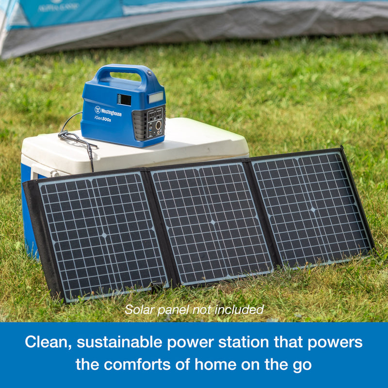 Westinghouse | iGen300s Portable Power Station sits atop a cooler. Leaning against the cooler are three solar panels that are plugged into the power station. A blue banner at the bottom reads, 