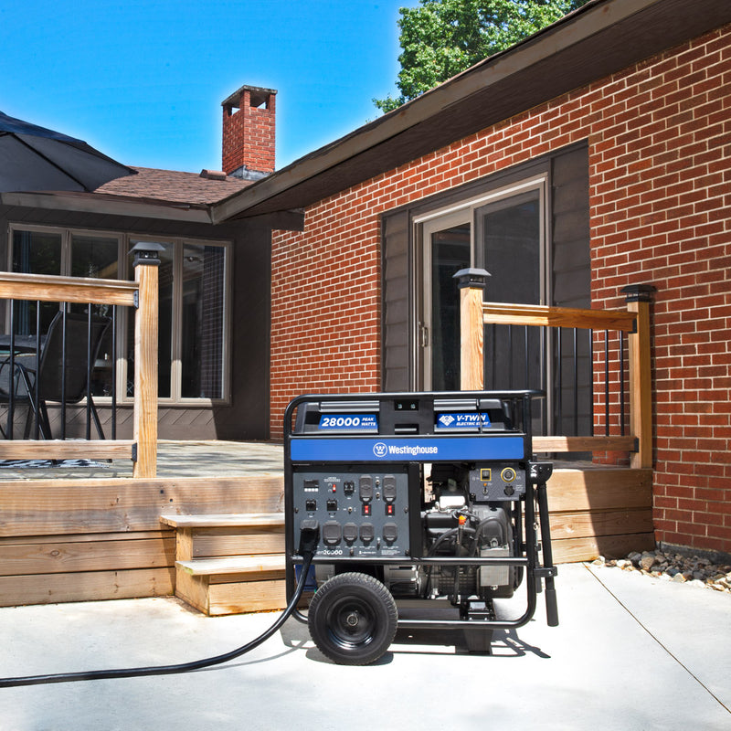 Westinghouse | WGen20000 portable generator shown sitting on the concrete with a back porch and house in the background