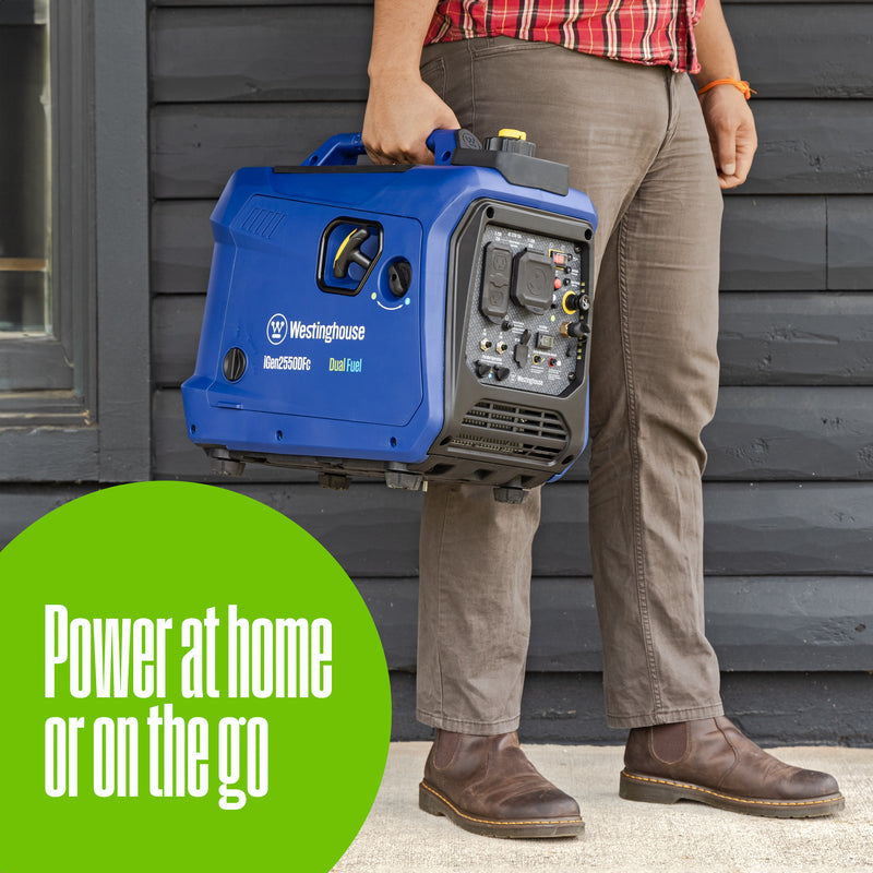 Westinghouse | iGen2550DFc dual fuel portable inverter generator with co sensor shown being carried in front of a house with words on the bottom saying: power at home or on the go