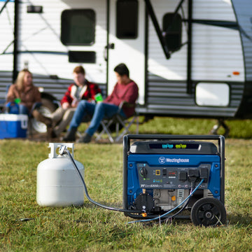 Westinghouse | WGen5300DFv portable generator hooked up to a propane tank. There are people sitting in chairs and a camper in the background.