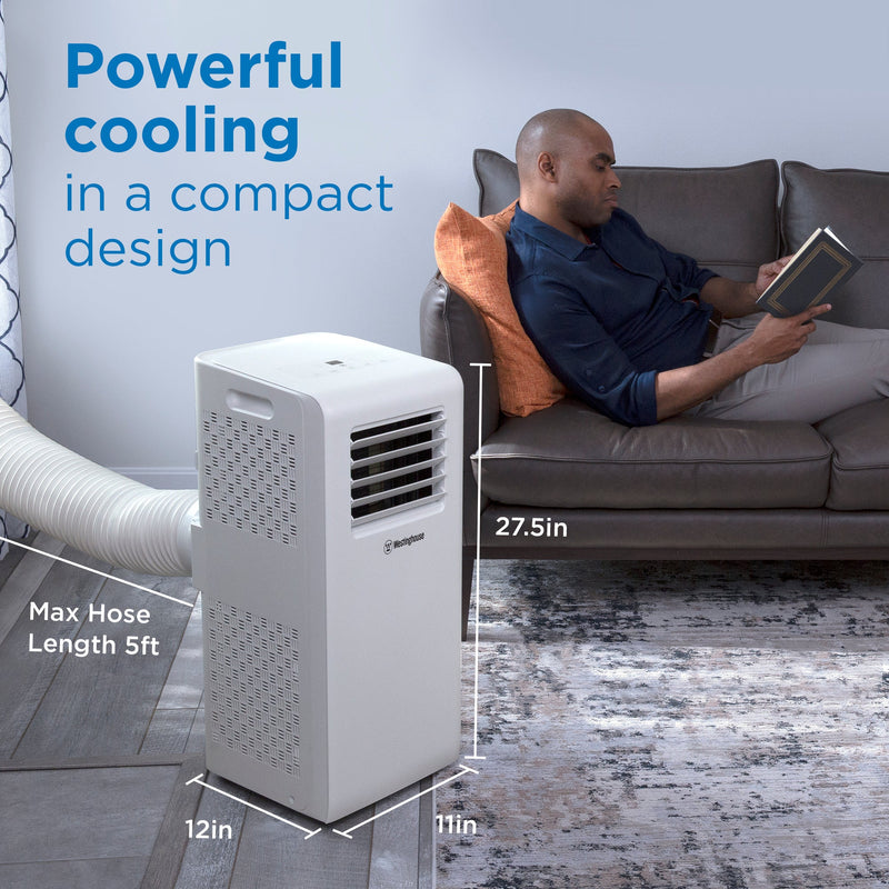 Westinghouse | WPac10000 Portable Air Conditioner shown in use with a man sitting on the couch reading. The image has words that state: power cooling in a compact design. The image shows the unit's dimensions, which are: 12L x 11W x 27.5H in. with a max hose length of 5ft.