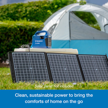Westinghouse | iGen200s Portable Power Station sits atop a cooler. Leaning against the cooler are three solar panels that are plugged into the power station. A blue banner at the bottom reads, "Clean, sustainable power station that powers the comforts of home on the go".