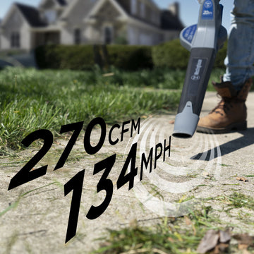 Closeup of leaf blower blowing grass off sidewalk. Text on screen says "270 cfm and 134 mph"