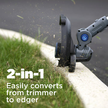 Closeup of edger cutting grass near a curb. In the left corner is white text on a grassy background that says "2-in-1. Easily converts from trimmer to edger"