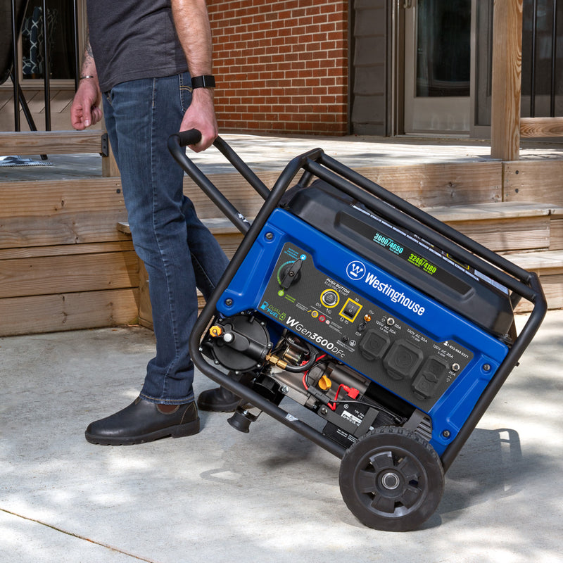 Westinghouse | WGen3600DFc portable generator  being pulled by the handle along a driveway.