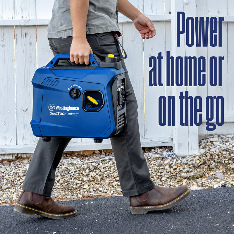 Westinghouse | iGen1500c portable inverter generator with co sensor shown being carried by a man outside of someone's house with words on the side of the image that say: power at home or on the go