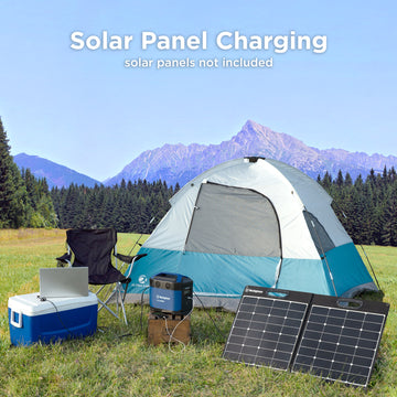 Westinghouse | iGen1000s portable power station shown being charged by solar panel and charging a laptop. The text at the top of the image says, solar panel charging, solar panels not included. There is a tent and chair in the background and the laptop is sitting on a cooler. 