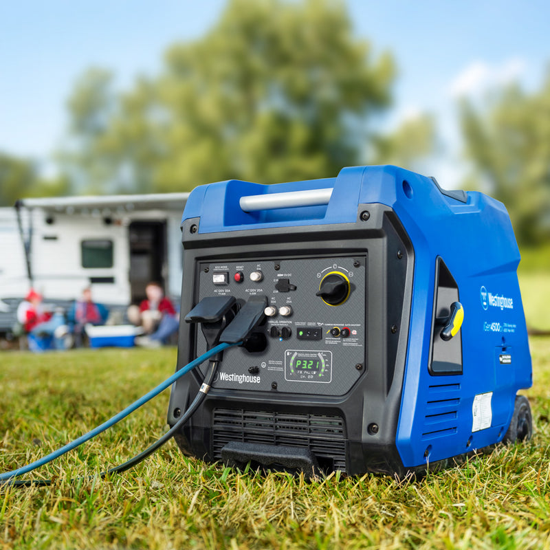 Westinghouse | iGen4500cv inverter generator sitting in grass with a camper and people in the background.