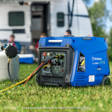 Westinghouse | iGen4500DF inverter generator sitting in the grass connected to a propane tank with people camping in the background.