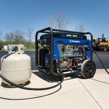Westinghouse | WGen7500DF portable generator sitting on sidewalk hooked up to propane tank.